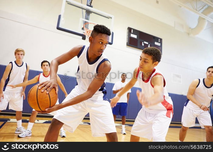 Male High School Basketball Team Playing Game