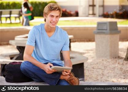 Male High School Student Using Digital Tablet Outdoors
