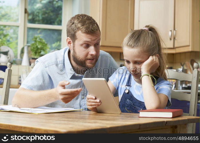 Male Home Tutor Helping Girl Struggling With Studies