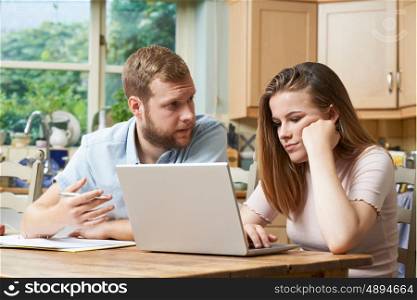 Male Home Tutor Helping Girl Struggling With Studies