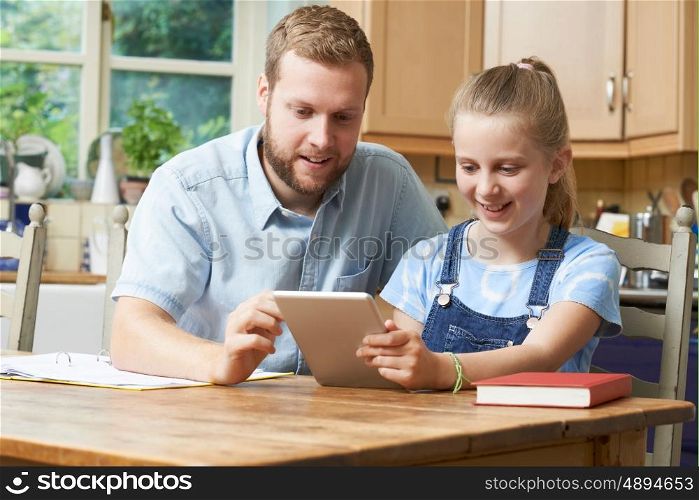 Male Home Tutor Helping Girl With Studies
