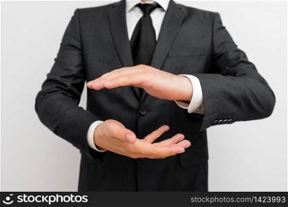 Male human with beard wear formal working suit clothes raising one hand up. Male human with beard wear formal working clothes raising one hand up. Man dressed in work suit plus tie raised fore indexfinger. photo of silent and permission