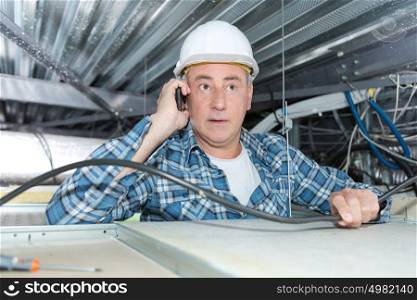 male insulation installer on phone
