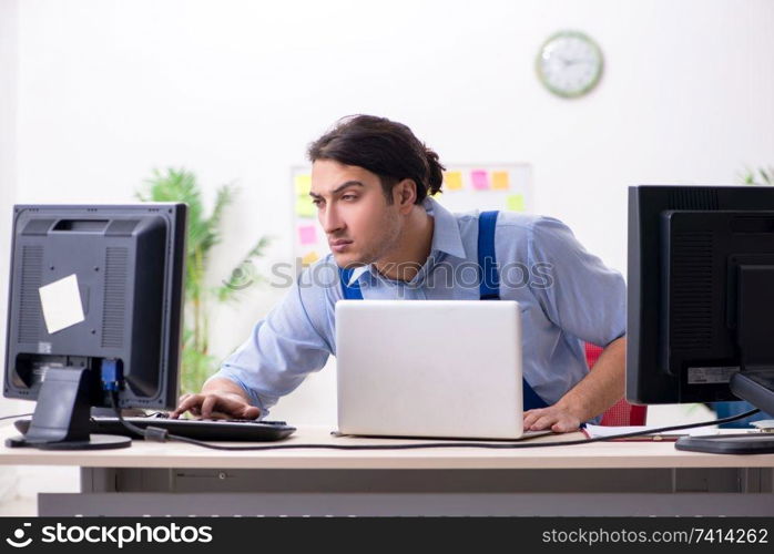 Male it specialist working in the office 