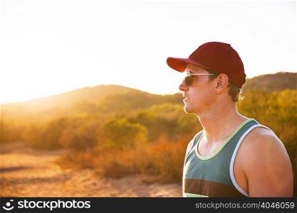 Male jogger in sunglasses and baseball cap, Poway, CA, USA