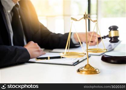 Male Judge lawyer In A Courtroom Striking The Gavel on sounding block