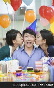 Male Kissed By Two Female Colleagues