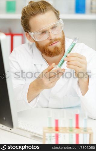 male lab worker using a pipette