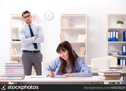 Male lecturer giving lecture to female student