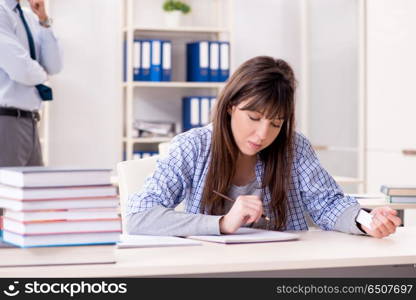 Male lecturer giving lecture to female student