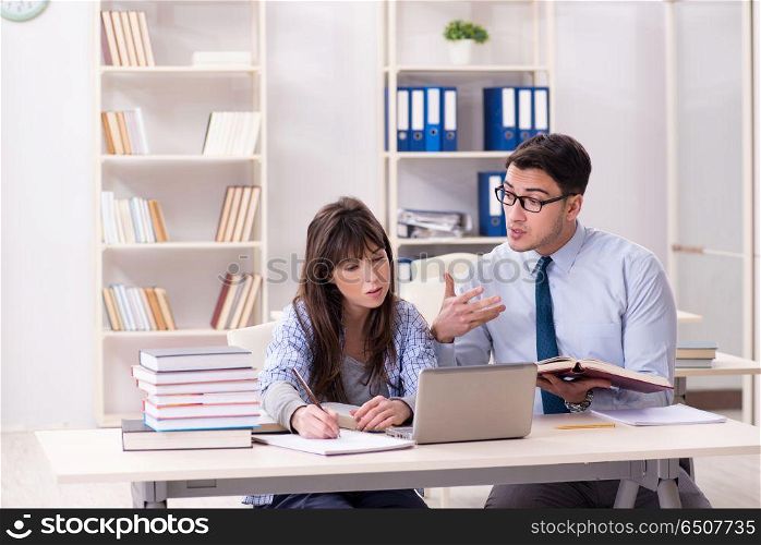 Male lecturer giving lecture to female student