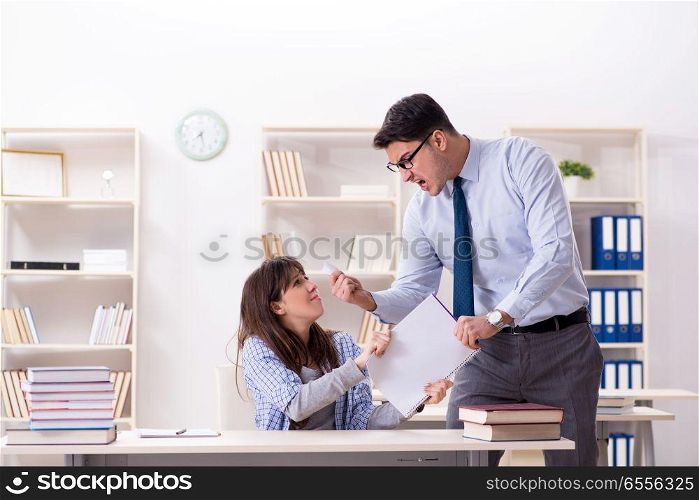 Male lecturer giving lecture to female student