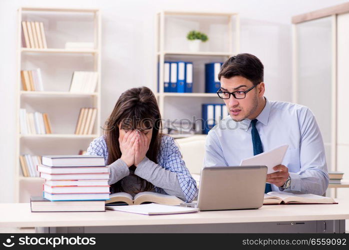 Male lecturer giving lecture to female student