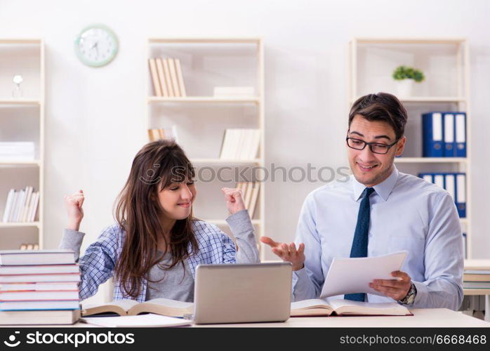 Male lecturer giving lecture to female student