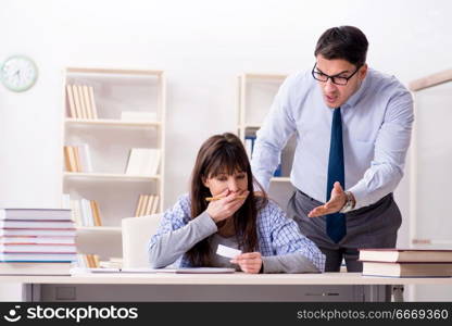 Male lecturer giving lecture to female student