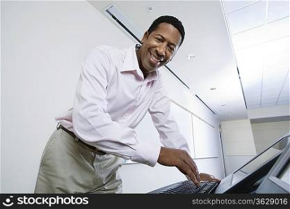 Male lecturer using computer