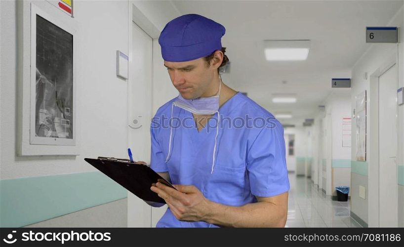 Male medical worker smiles on the job