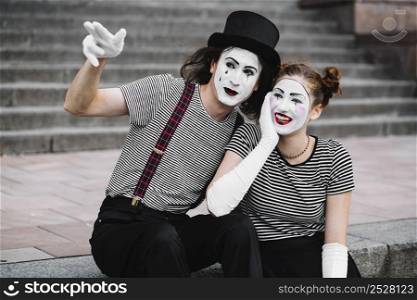 male mime showing something happy female mime