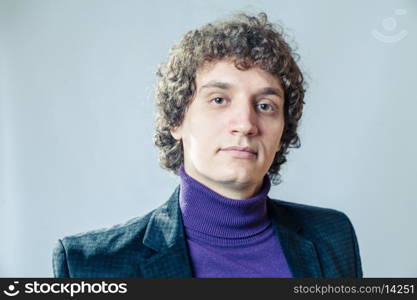 Male model. Curly white man in studio