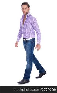 Male model wearing casual wear and walking over white background