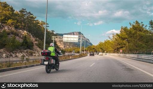 Male motorbike rider on his motorbike on the highway. Male motorbike rider