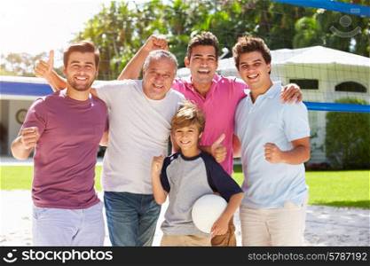 Male Multi Generation Family Playing Volleyball In Garden