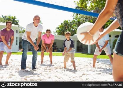 Male Multi Generation Family Playing Volleyball In Garden
