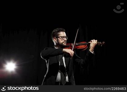 male musician playing violin