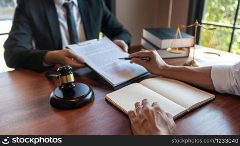 Male Notary lawyer or judge consult or discussing contract papers with Businessman client in office, Law and Legal services concept.