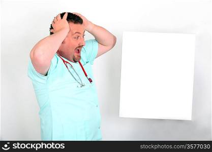 Male nurse shocked with white panel for message