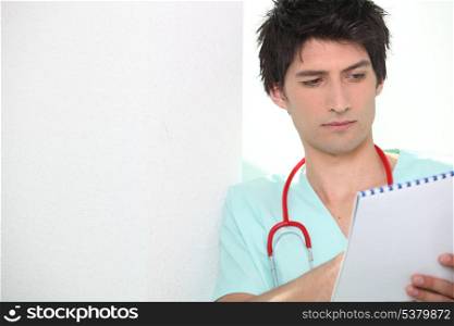Male nurse with notebook
