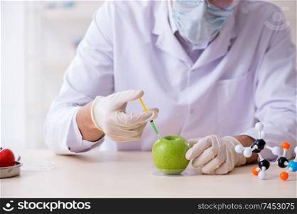 Male nutrition expert testing food products in lab