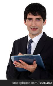 Male office worker with clip-board and pen