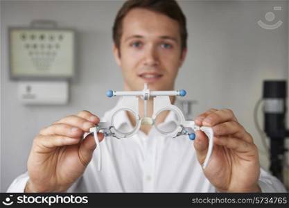 Male Optician Giving Patient Sight Test