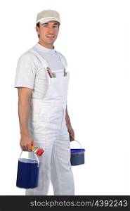 Male painter carrying paint pots