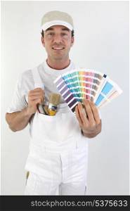 Male painter choosing colours