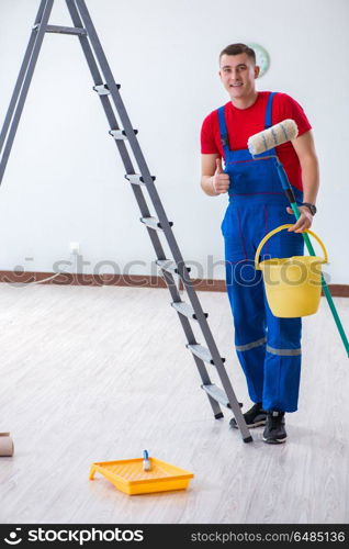 Male painter preparing for painting job at construction site