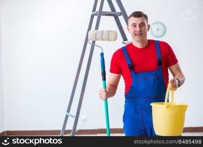 Male painter preparing for painting job at construction site