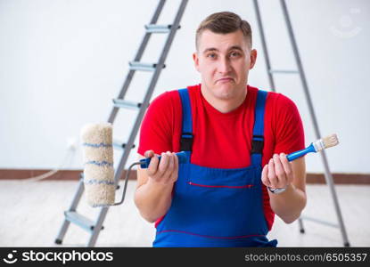 Male painter preparing for painting job at construction site