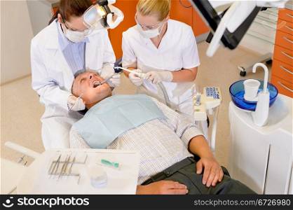 Male patient having dental checkup at surgery stomatology clinic