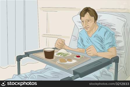Male patient in a hospital bed with food in front of him