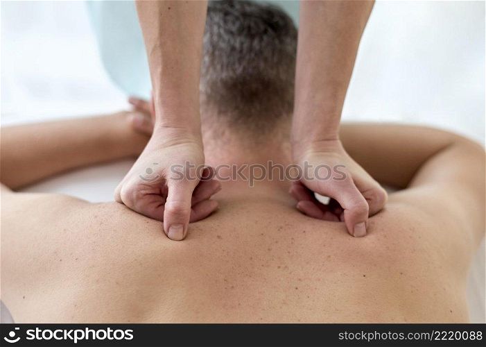 male patient undergoing therapy with physiologist