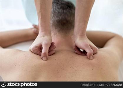 male patient undergoing therapy with physiologist