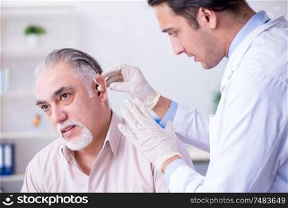 Male patient with hearing problem visiting doctor otorhinolaryngologist. Male patient with hearing problem visiting doctor otorhinolaryng