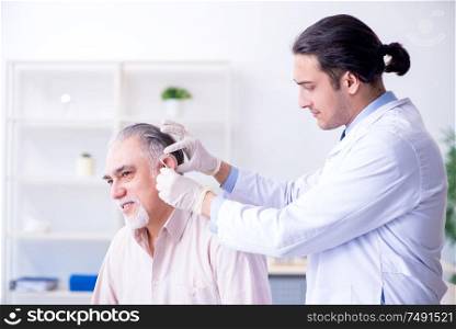 Male patient with hearing problem visiting doctor otorhinolaryngologist. Male patient with hearing problem visiting doctor otorhinolaryng