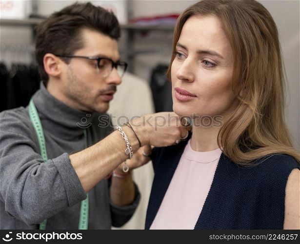 male personal shopper helping cutomer