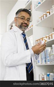 Male pharmactist working in pharmacy