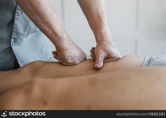 male physiotherapist massage session with female patient. High resolution photo. male physiotherapist massage session with female patient. High quality photo