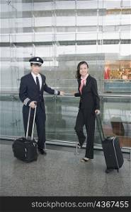 Male pilot and a female cabin crew at an airport