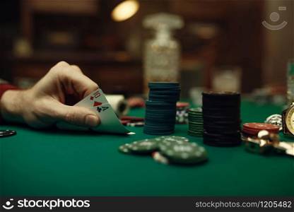 Male player hands with ace and ten cards, blackjack, casino, luck addiction. Games of chance. Man leisures in gambling house, gaming table with green cloth